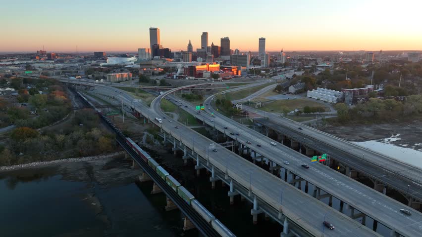 Tulsa Oklahoma skyline at sunrise. Aerial of interstate highway bridges.