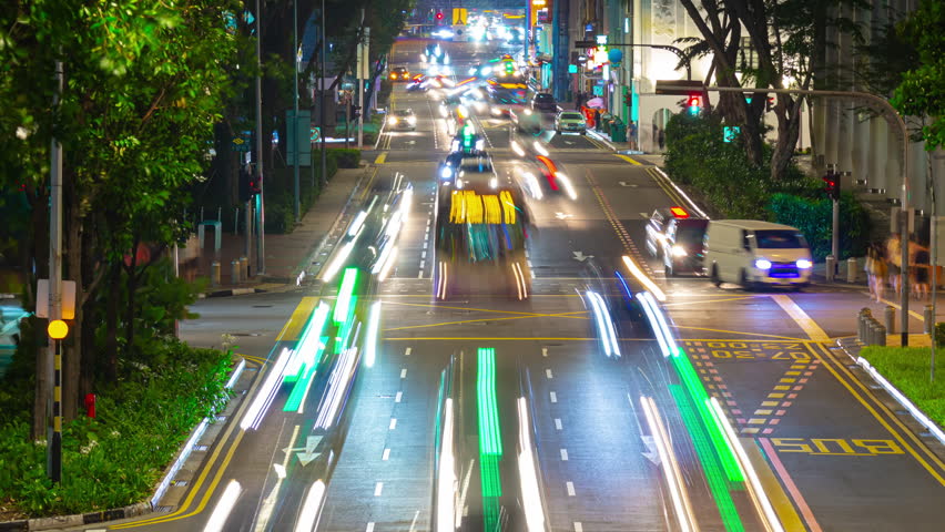 singapore city center night time illuminated traffic street road pedestrian bridge timelapse panorama 4k