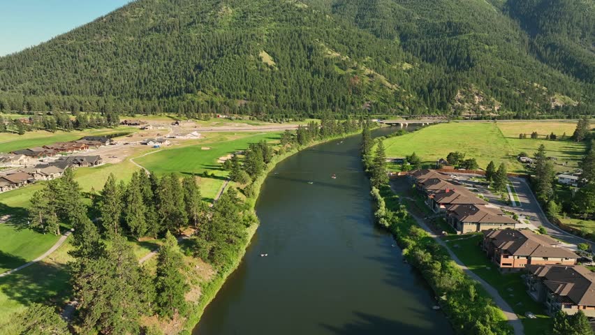 Aerial View Of River Between Holiday Houses And Golf Course In Missoula, Montana.