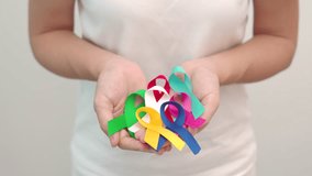 World cancer day, February 4. Colorful ribbons for supporting people living and illness. Healthcare, fighting, medical and National Cancer Survival day, Autism awareness day concept - Powered by Shutterstock - Get 15% off with code: PIKWIZARD15