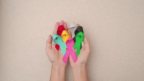 World cancer day, February 4. Colorful ribbons for supporting people living and illness. Healthcare, fighting, medical and National Cancer Survival day, Autism awareness day concept - Powered by Shutterstock - Get 15% off with code: PIKWIZARD15