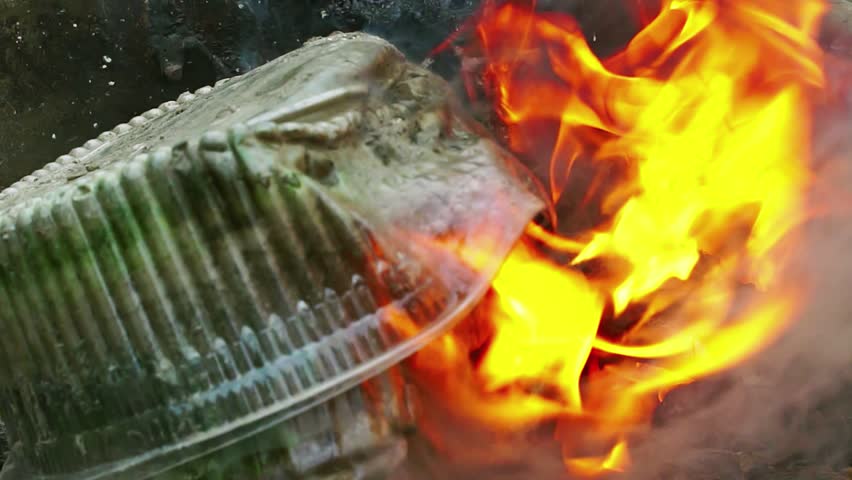 burning plastic packaging pollutes the environment with toxic smoke Royalty-Free Stock Footage #1098144221