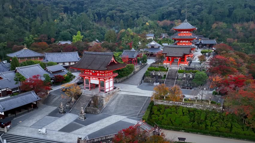Kyoto buddhist temple aerial view, famous Kiyomizudera temple in Kyoto, Japan, in autumn, red historic pagodas of a religious Asian building.  Royalty-Free Stock Footage #1098145109
