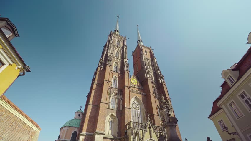 View of the Cathedral of St. John the Baptist in Wroclaw on Ostrow Tumski. Old town, Poland, church, architecture, Roman Catholic, gothic, neo-gothic, gimbal. 4K Video Footage.
