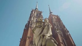 View of the Cathedral of St. John the Baptist in Wroclaw on Ostrow Tumski. Old town, Poland, church, architecture, Roman Catholic, gothic, neo-gothic, gimbal. 4K Video Footage.