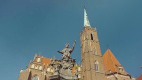 View of the Collegiate Church of the Holy Cross and St Bartholomew in Wroclaw on Ostrow Tumski. Old town, Poland, church, architecture, Roman Catholic, gothic, neo-gothic, gimbal. 4K Video Footage.
