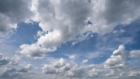 Blue sky white clouds. Puffy fluffy white clouds. Cumulus cloud cloudscape timelapse. Summer blue sky time lapse. Nature weather blue sky. White clouds background. Cloud time lapse , video loop