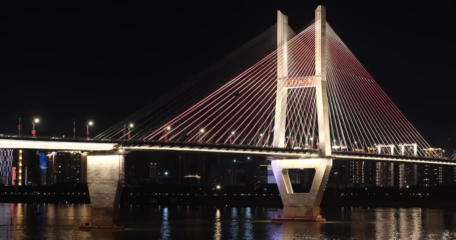 part of colorful Second Wuhan Yangtze River Bridge and traffic at night. A cable-stayed bridge across the Yangtze River in Wuhan, Hubei province, China