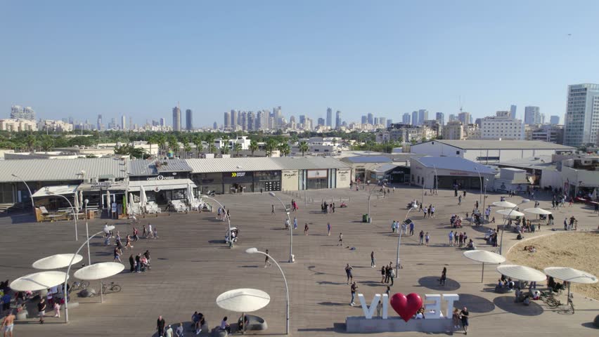 Push in over Tel Aviv Port Promenade and revealing the Beautiful city's skyline #015