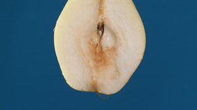 Detail of pear slice with water falling on the piece in slow motion - Powered by Shutterstock - Get 15% off with code: PIKWIZARD15