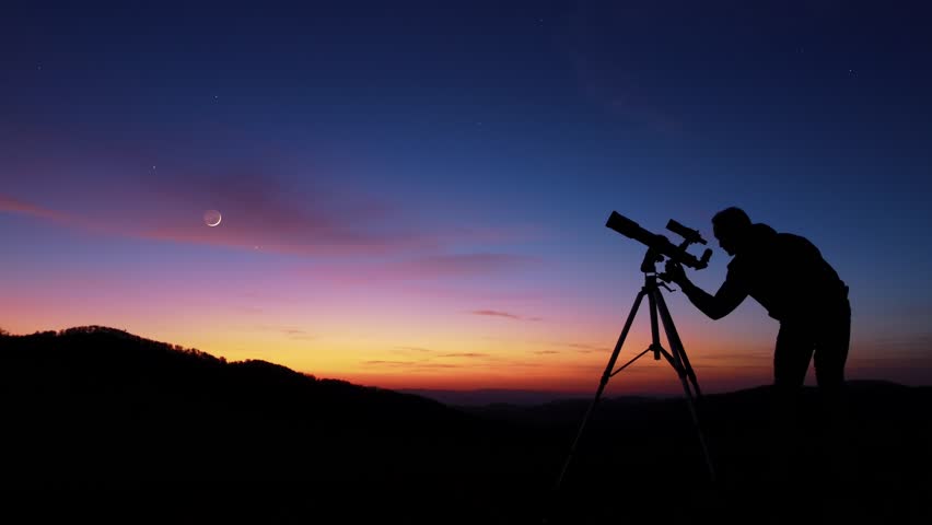 Man with astronomy telescope looking at the night sky, stars, planets, Moon and shooting stars. | Shutterstock HD Video #1098185575