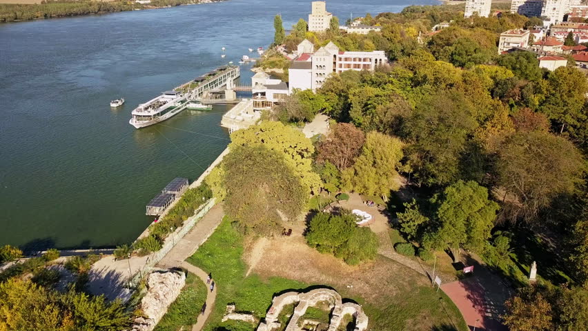Passenger Cruise Ship Dock In The Danube River On A Sunny Day In Ruse, Bulgaria. - aerial
