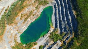 Drone flying over a quarry in the tropical, large commercial industry for infrastructure. pollution problems from dust respiratory tract and environmental problems concept. Aerial view footage. 4K
