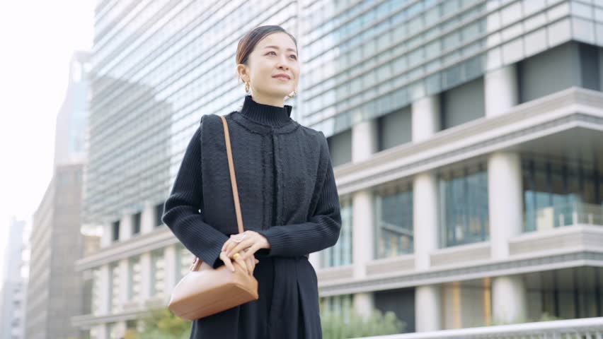 Businesswoman walking in business district | Shutterstock HD Video #1098197357