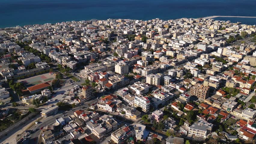 Aerial view around the city Corinth in Greece on a late sunny afternoon.