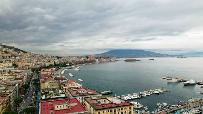 The drone takes off over the city of Naples. Drone view of the entire Gulf of Naples in Italy