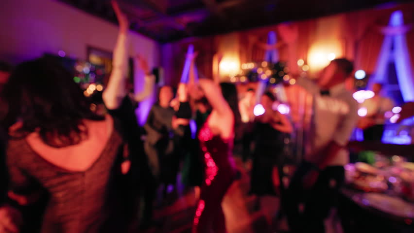 Defocused: People are dancing and partying in red lights Royalty-Free Stock Footage #1098208057