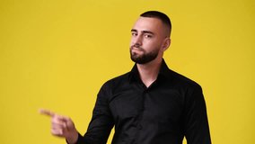 4k slow motion video of one man gesturing no over yellow background.