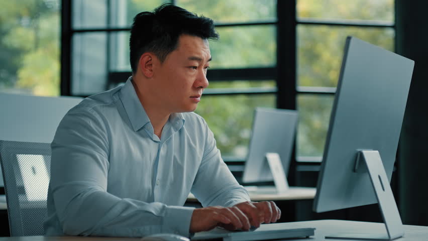 Korean asian ethnic man specialist office manager typing on keyboard chatting online tired male disappointed about mistake failed computer work business problem receive wrong result rejection notice Royalty-Free Stock Footage #1098212303