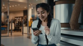 Young hispanic woman ethnic girl businesswoman student excited female user win discounts on mobile phone business achievement success receive good news celebrate victory online profit new smartphone - Powered by Shutterstock - Get 15% off with code: PIKWIZARD15