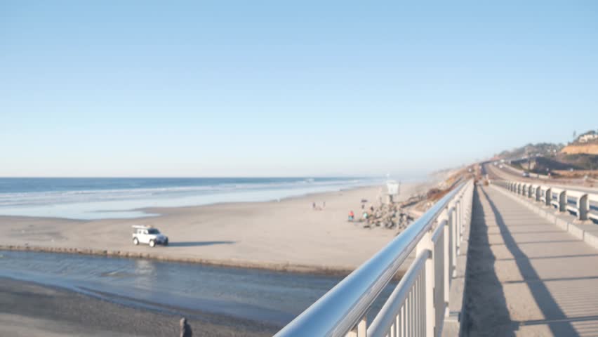 Lifeguard car truck, life guard station on ocean beach by sea waves. Pacific coast highway roadtrip, Torrey Pines state beach, freeway 101 from San Diego to Del Mar. California coastal vacations, USA.