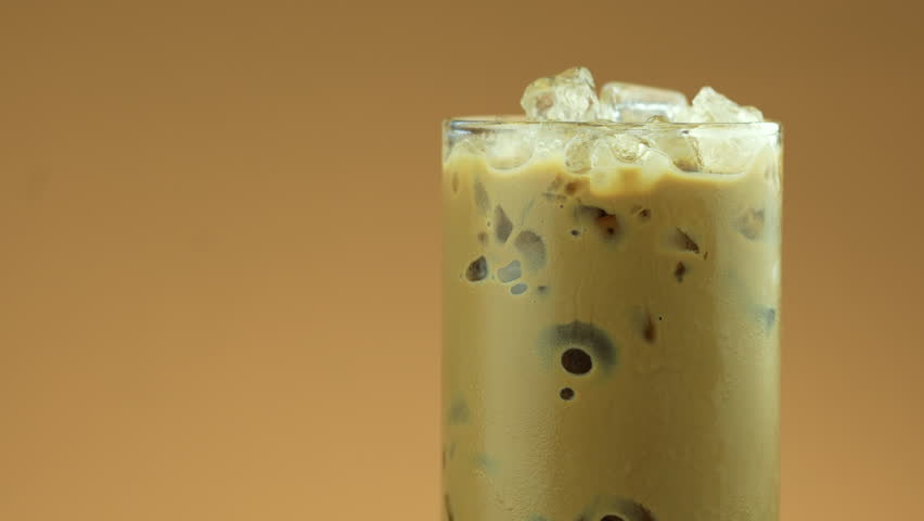 Iced Mocha coffee in a tall glass. Rotate and close up shot | Shutterstock HD Video #1098215751