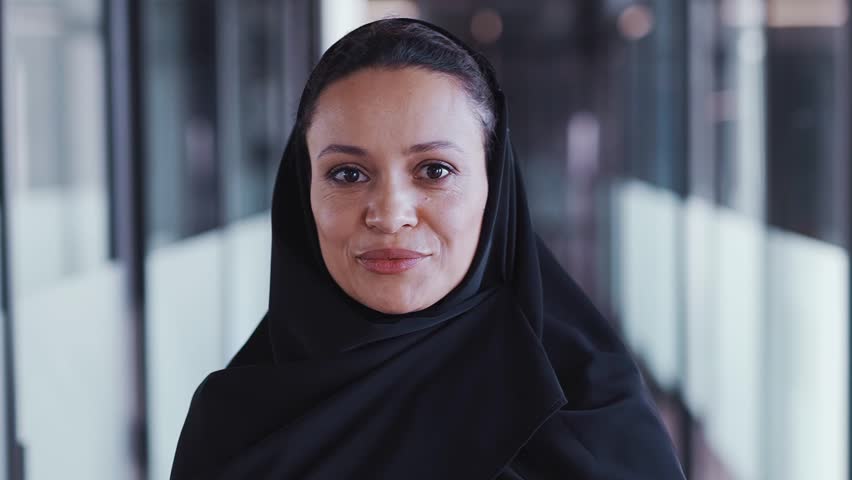 beautiful woman with abaya dress working on her project. Middle aged female employee at work in a business office in Dubai. Concept about middle eastern cultures and lifestyle
 Royalty-Free Stock Footage #1098218557