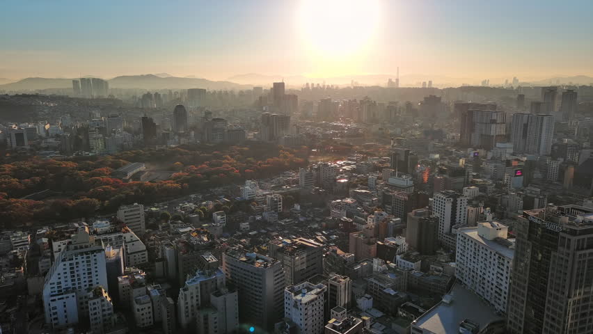 Seoul: Aerial view of capital city of South Korea, Jongmyo Shrine in Hunjeong-dong at sunrise, trees in autumn colors - landscape panorama of East Asia from above