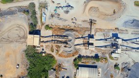 Drones are flying over stone crushing plant. commercial stone industry. Construction and respiratory pollution concept. environmental issues. Southeast asia. Aerial view footage. 4K
