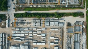 Aerial view from a drone flying over a many concrete material on outside storage yard. construction industry. logistics and transportation concept. southeast asia. aerial view footage. 4K
