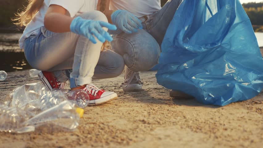 kids collecting trash volunteer a teamwork. child group happy family on collects garbage plastic trash waste ecology bottles. environmental happy family teamwork volunteer awareness trash pollution Royalty-Free Stock Footage #1098230805