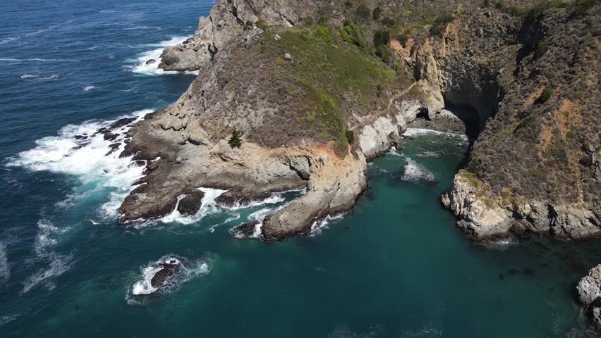 Aerial shot of the rugged coastline along the Pacific Coast Highway in Central California
