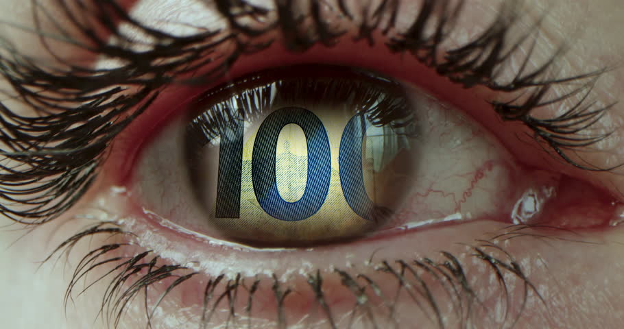 Close-up of the opening of the eyes with brown iris, all red with inflamed protein from long work at the computer. Us dollars bills money in eye looking in woman close-up.. Macro video in front in 4K.