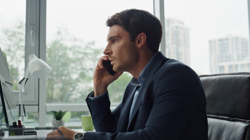 Annoyed manager shouting mobile phone closeup. Mad entrepreneur calling partner solving financial crisis problems. Angry bank client customer explain complain in office. Corporate worker talking cell  Royalty-Free Stock Footage #1098239383
