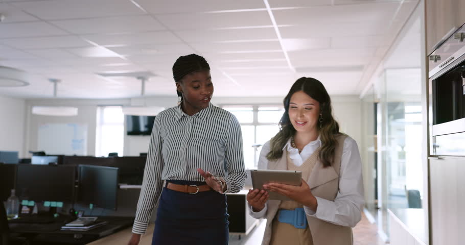 Business women, tablet and walking in office talking for partnership collaboration, creative designer team and web design conversation. Teamwork, employees website discussion and walk in tech agency | Shutterstock HD Video #1098241009