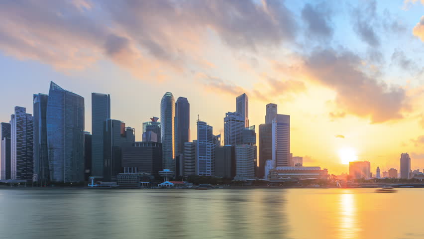 Golden Sunset Time lapse of day to night of Singapore CBD skyline by a river in Singapore. Prores Full HD Timelapse.