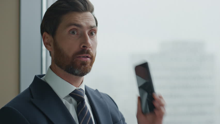 Portrait of furious manager calling phone gesturing emotionally standing at office panoramic window. Angry nervous boss yelling in telephone dissatisfied work results closeup. Director feeling despair | Shutterstock HD Video #1098253679