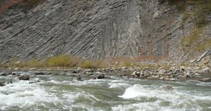 Beautiful mountain river with rapid current. The Prut river and mountain folds in Yaremche City, Ukraine, known as Yaremche folds - biggest outcrop of Stryi formation in Europe, video with water noise