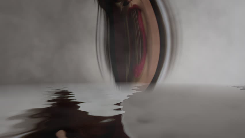 Scary girl morphing reflected in water