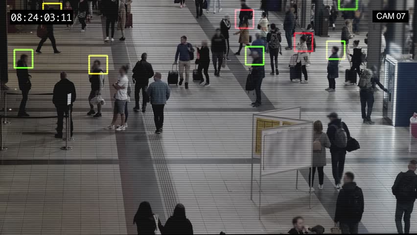 Interface of the display connected to the global people identification system. The surveillance camera with facial recognition collects and processes information about persons passing by. High quality Royalty-Free Stock Footage #1098261741