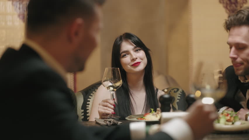Friends dinner in restaurant in Christmas holiday or Birthday of pretty brunette woman | Shutterstock HD Video #1098265587