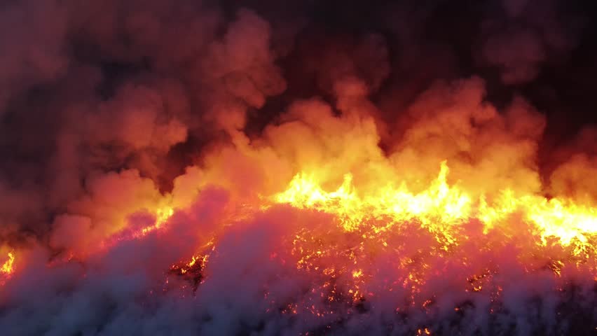 wild fire in spring aerial. wildfire smoke, air pollution. European wildfires in spring. critical fire season. natural disasters. intense and dangerous wildland fire, big forest fire, crown fires Royalty-Free Stock Footage #1098266947