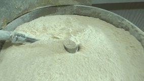 Flour dough making machine. Dough making process for making ravioli. Automatic production of dumplings. Food industry, food production. 4K video shooting.