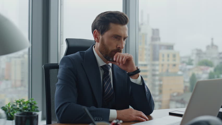 Pensive project manager creating new business ideas sitting modern office desk with laptop close up. Attractive bearded serious businessman ceo thinking startup strategy making notes in notebook. | Shutterstock HD Video #1098268089