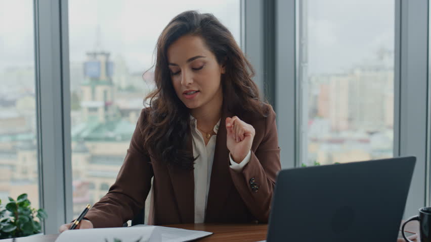 Attractive business consultant talking at online negotiation sitting luxury office closeup. Confident woman executive manager communicating using video chat looking at web camera. Ceo working remotely | Shutterstock HD Video #1098268193