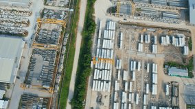 4K : Drones are flying over a many concrete material on outside storage yard. concrete and construction industry. logistics and infrastructure concept. southeast asia. aerial view footage
