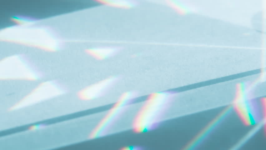 Optical Lens System Creates a Glare. Loop. The optical lens system creates a series of bright, changing geometric highlights on a light surface - Powered by Shutterstock - Get 15% off with code: PIKWIZARD15