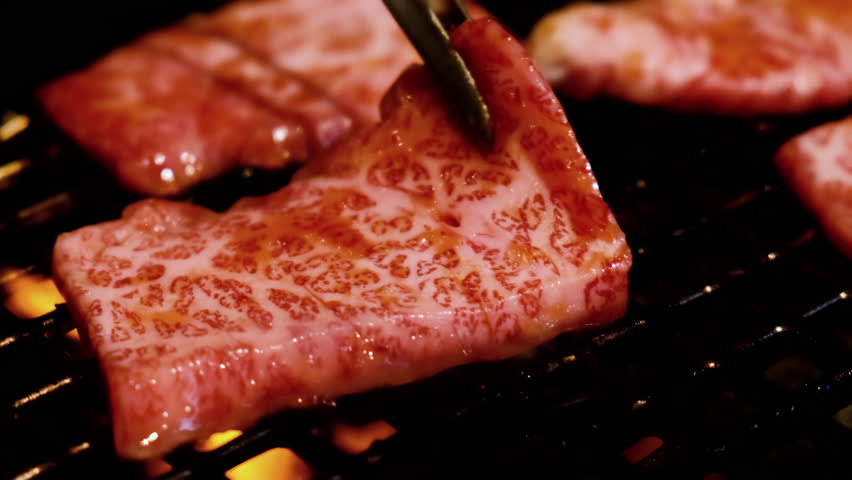 Grilled Wagyu beef sliced Yakiniku in restaurant, Japanese style barbecue. Royalty-Free Stock Footage #1098279293