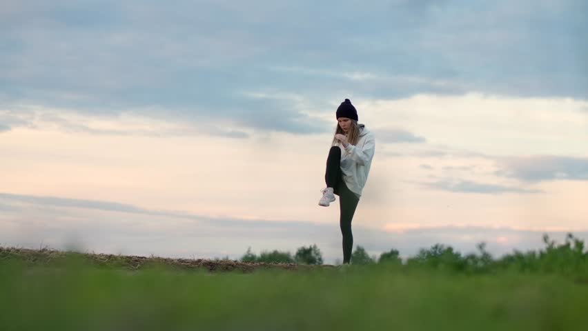 Woman runs in the field. Outdoor training. | Shutterstock HD Video #1098282383