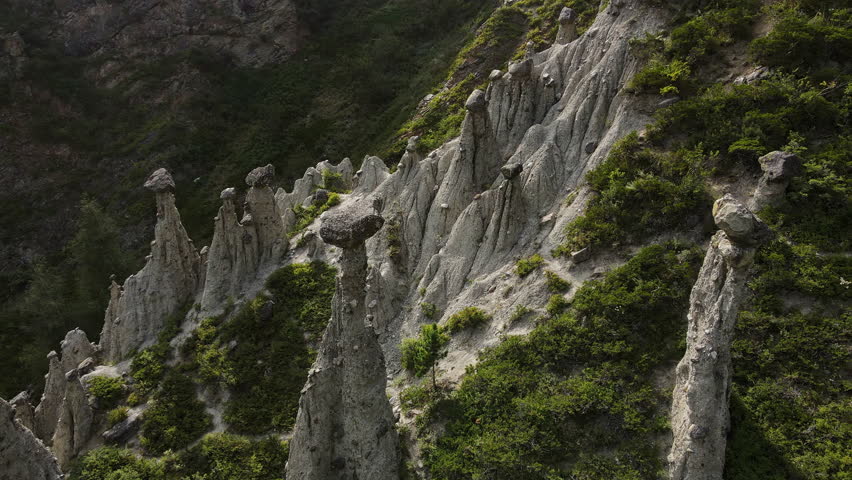 Aerial view of natural rock formations Stone mushrooms in the Altai Nature Reserve in the Chulyshman River valley. Soil erosion. Tourist attraction. Close up